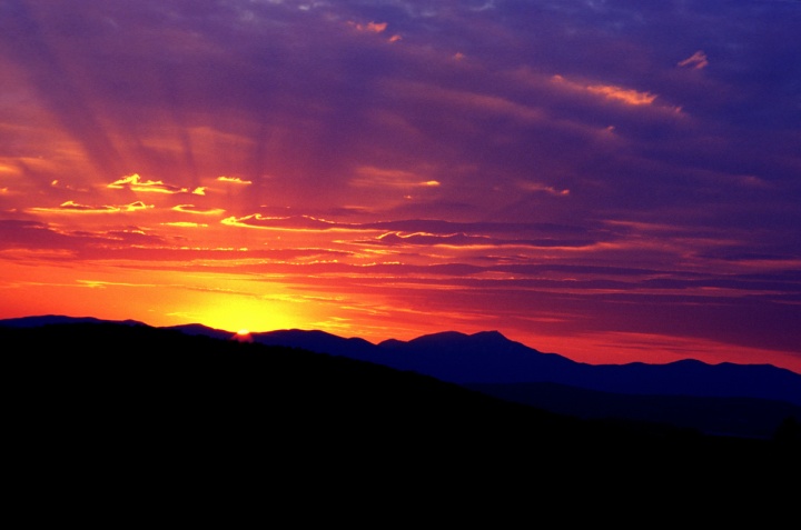A sunset over a mountain ridge.