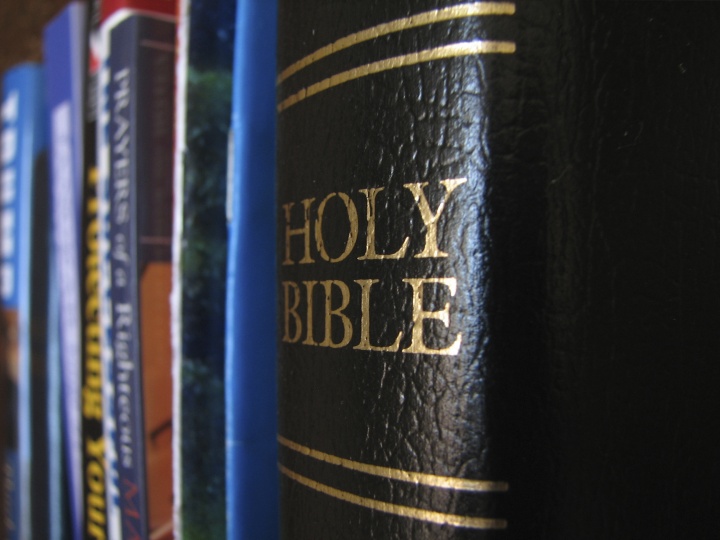 Bible on a book shelf.