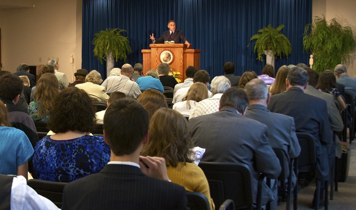 A church congregation listening to a sermon.