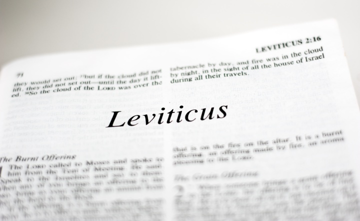 A Bible opened to the book of Leviticus.