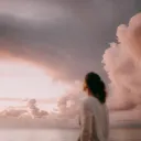 A woman looking up into the sky.