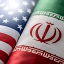 United States and Iranian flags.