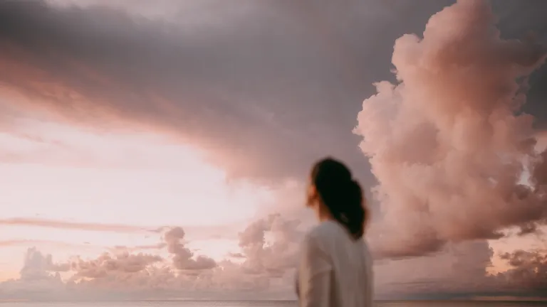 A woman looking up into the sky.