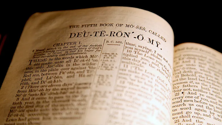 A Bible opened to the Book of Deuteronomy.