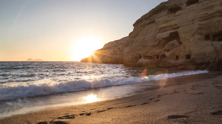 A sunset over a large body of water.