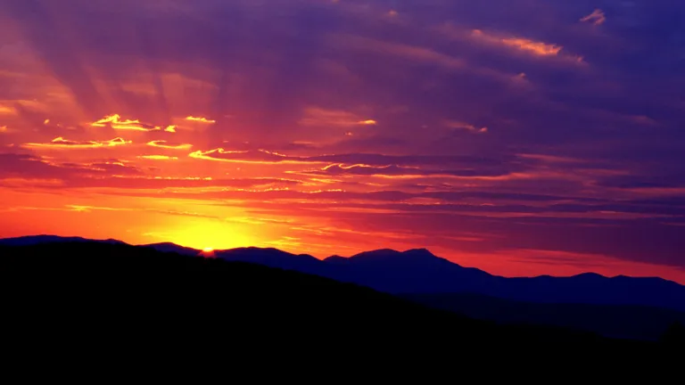 A sunset over a mountain ridge.