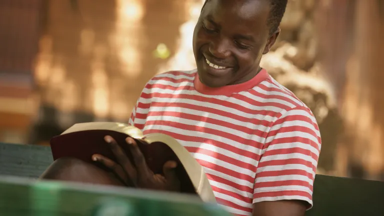 A young man reading the Bible.