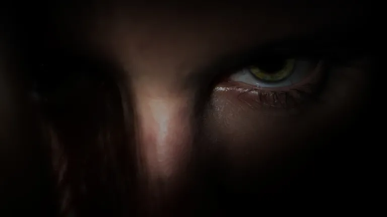 Silouette of person holding a knife.