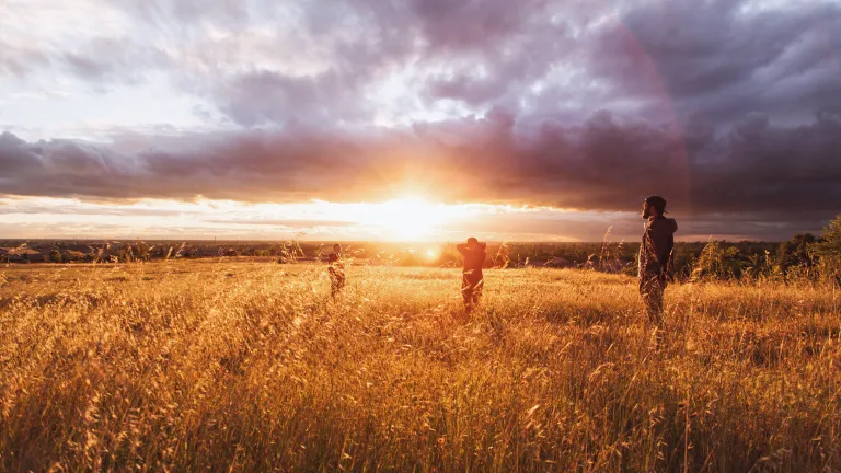 Sunset with people in foreground.
