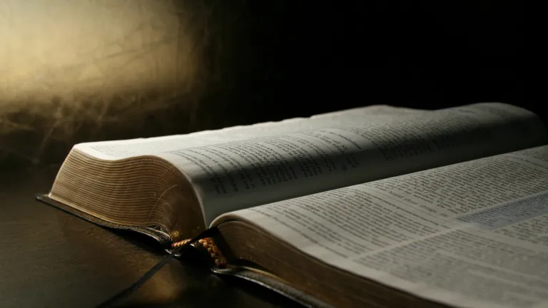 A open Bible laying on a table.