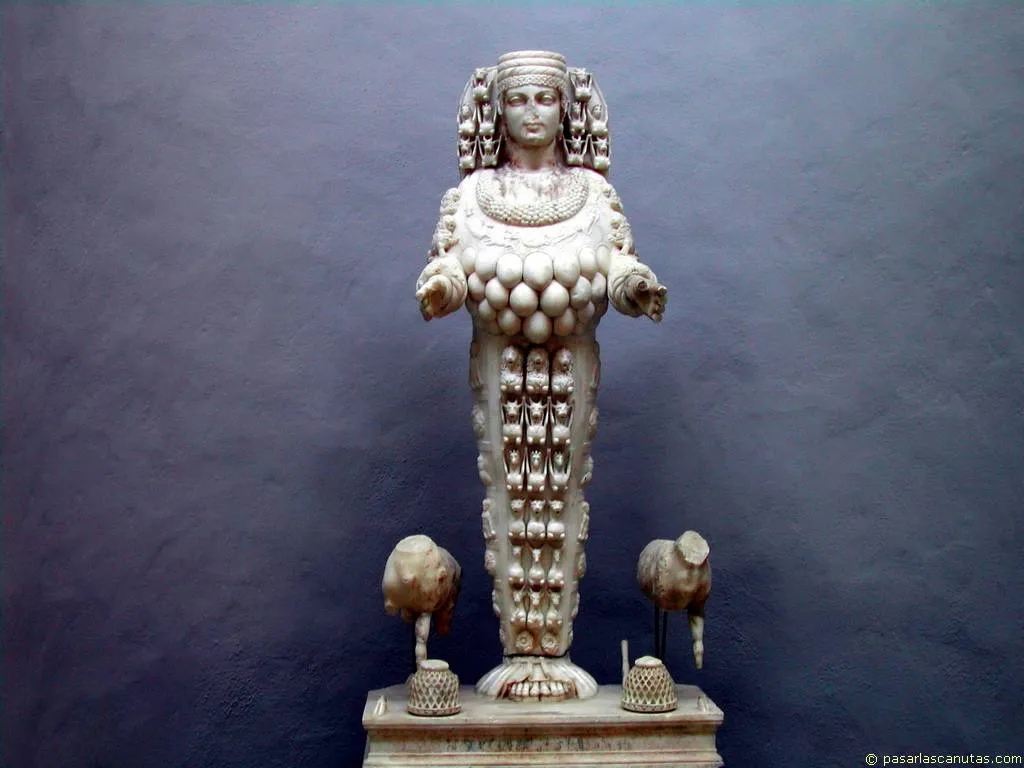La Artemisa de Éfeso era la diosa de la fertilidad y se le representaba con múltiples pechos, una corona de forma de torres y una especie de nimbo detrás de la cabeza. La Artemisa de Éfeso era la diosa de la fertilidad y se le representaba con múltiples pechos, una corona de forma de torres y una especie de nimbo detrás de la cabeza.