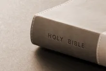 A Bible on a table.
