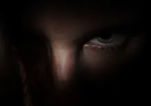 Silouette of person holding a knife.