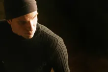 A man ready to break into a house and steal.