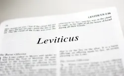 A Bible opened to the book of Leviticus.